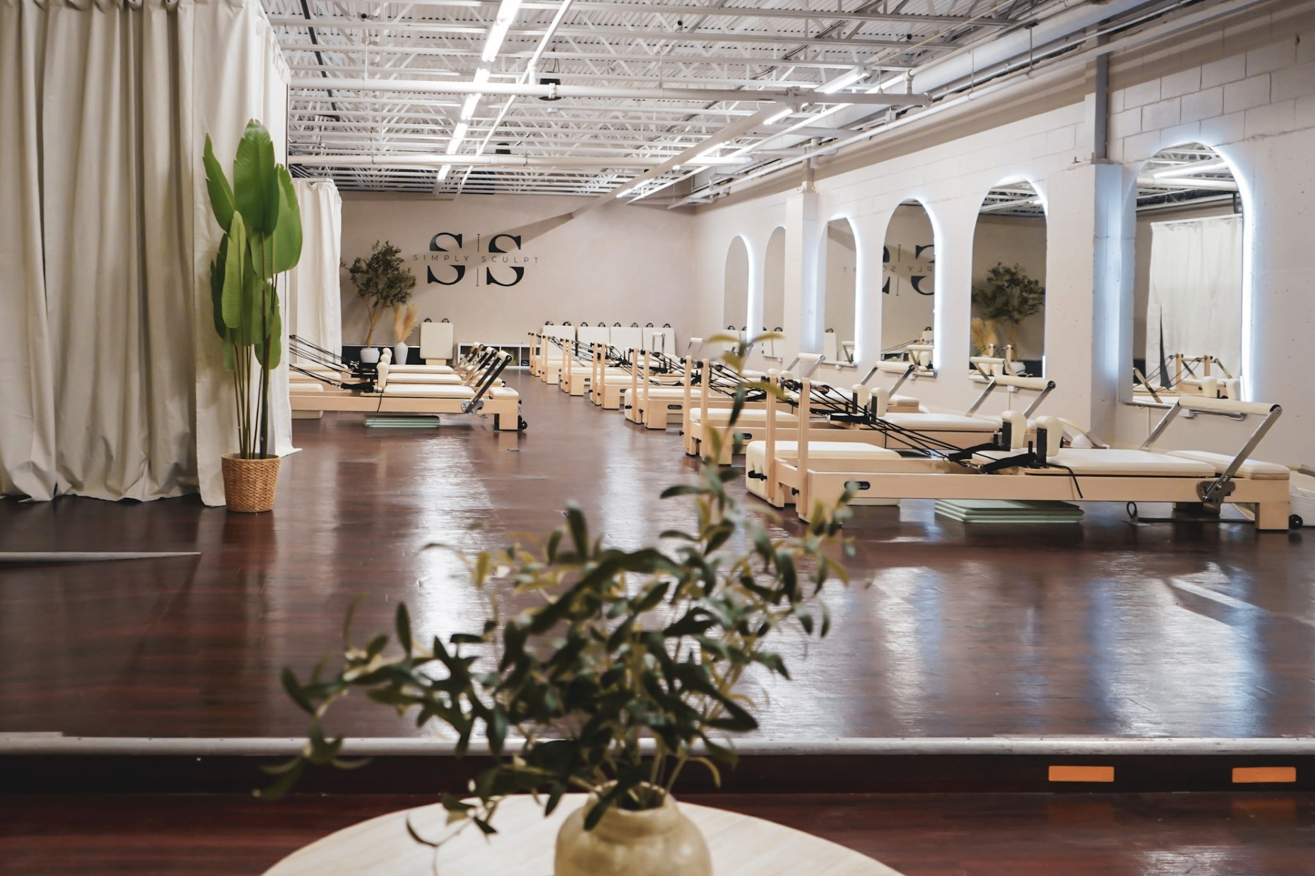 Bright Pilates studio with reformer machines